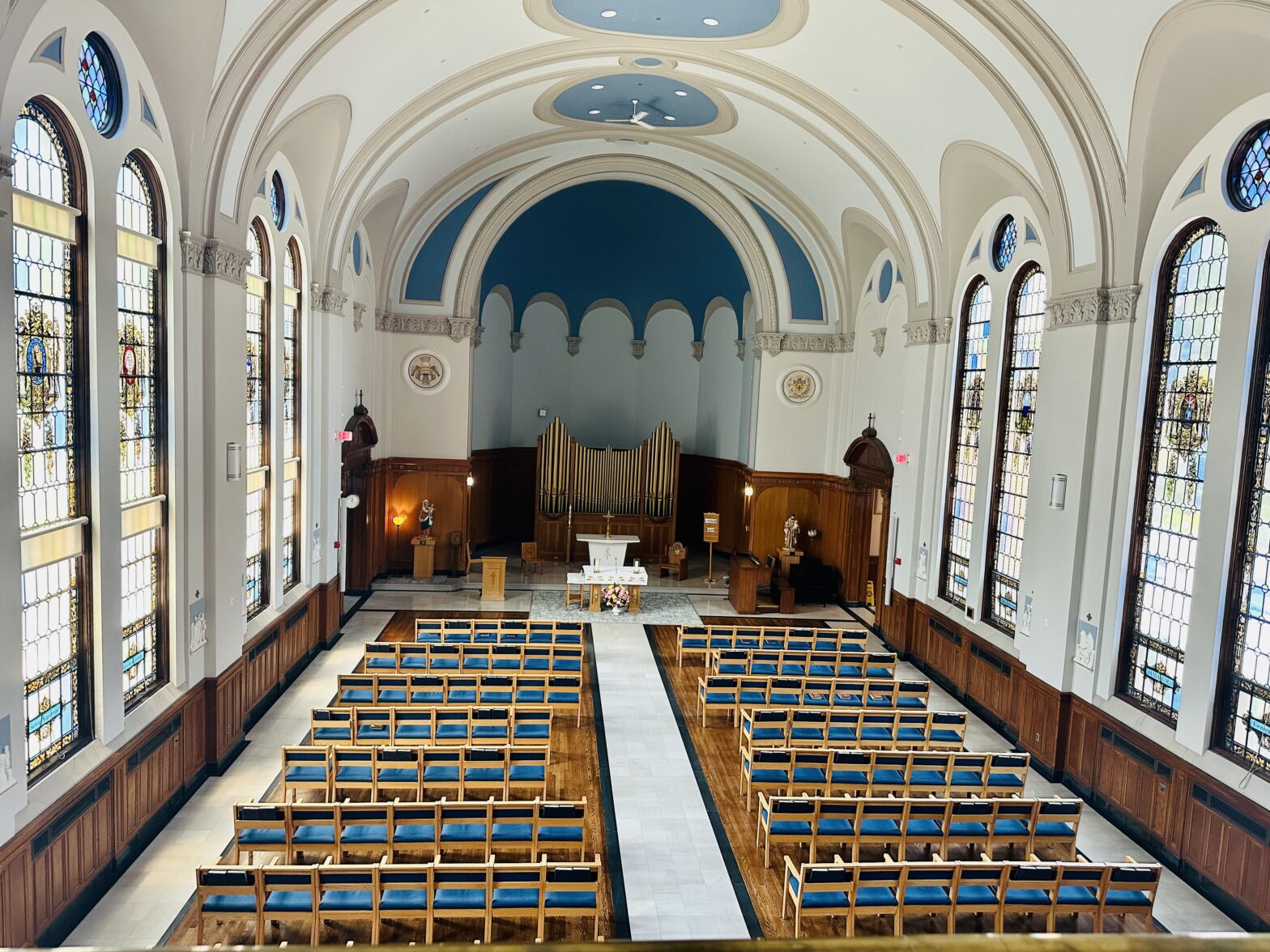 Du Lac Chapel, a church with rows of blue chairs.