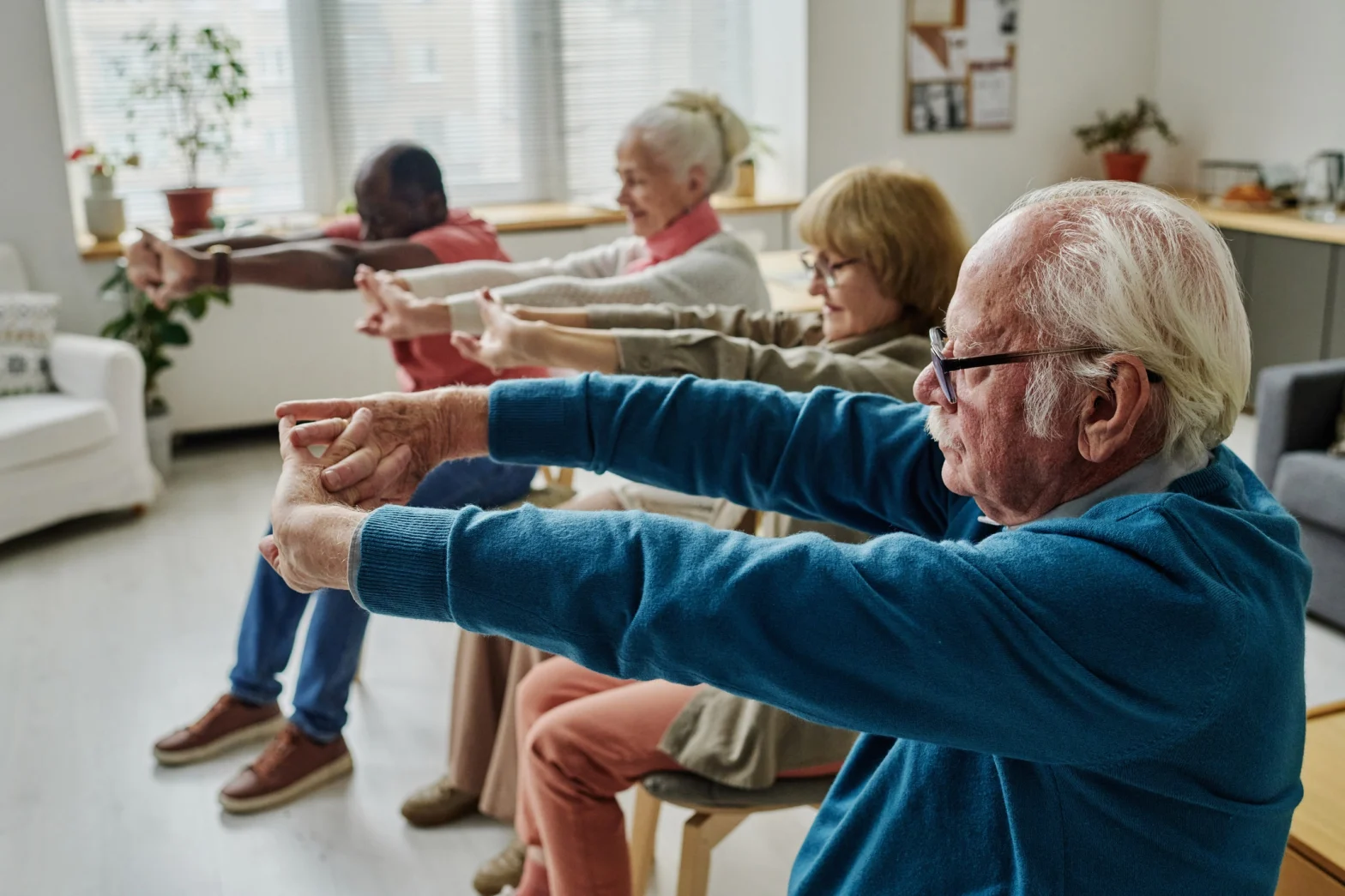 seniors doing seated exercises